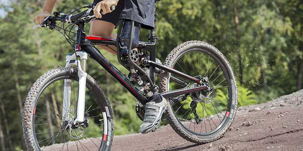 Man riding bike with a prosthetic leg