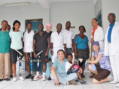 Group of Haitan people with prosthetist Kamil Leman