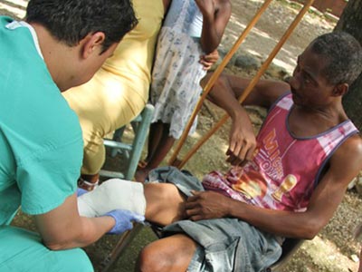 Disabled Haitan man with prosthetist Kamil Leman